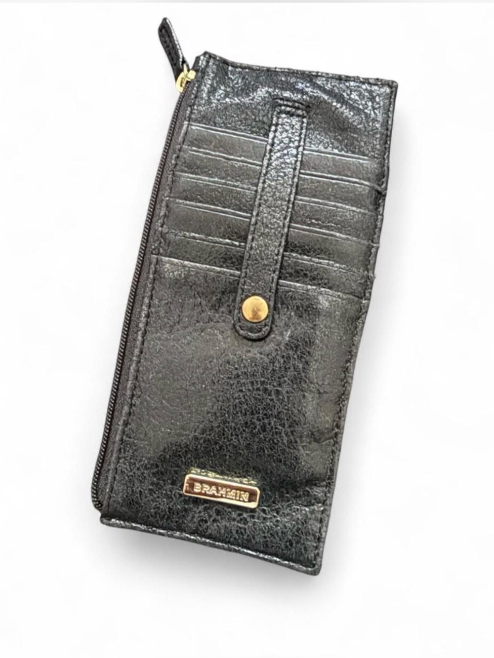 BRAHMIN Black leather card wallet with gold accents and textured surface.